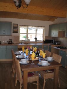 picture of kitchen and dining area - click for larger image. Opens in new tab